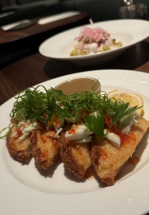 Golden, crispy shrimp toast topped with vibrant garnishes—an elevated take on a beloved comfort bite.